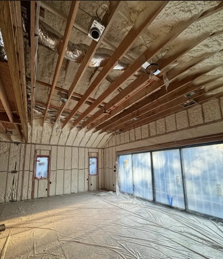 Interior walls and ceiling insulated with spray foam during new construction in McDonough